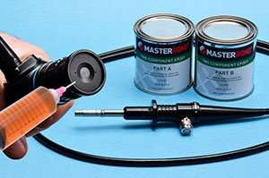 Two-part epoxy compound for medical device assembly.
