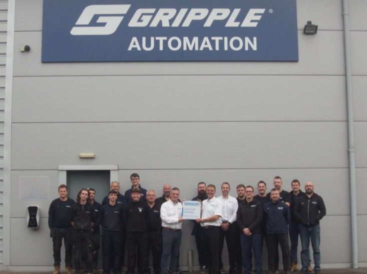 Robert Meechan, OMRON System Integrator Manager and Justin Newborn, Gripple Project & Application Manager hold partnership plaque.